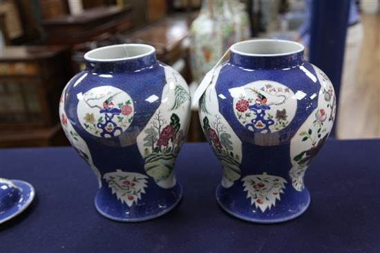 A pair of Chinese famille rose powder blue ground jars and covers, Kangxi marks, early 20th century, height 31.5cm